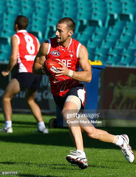Nick Malceski of the Swans runs with the ball during a Sydney Swans AFL training session at the Sydney Cricket Ground on May 14, 2008 in Sydney,...