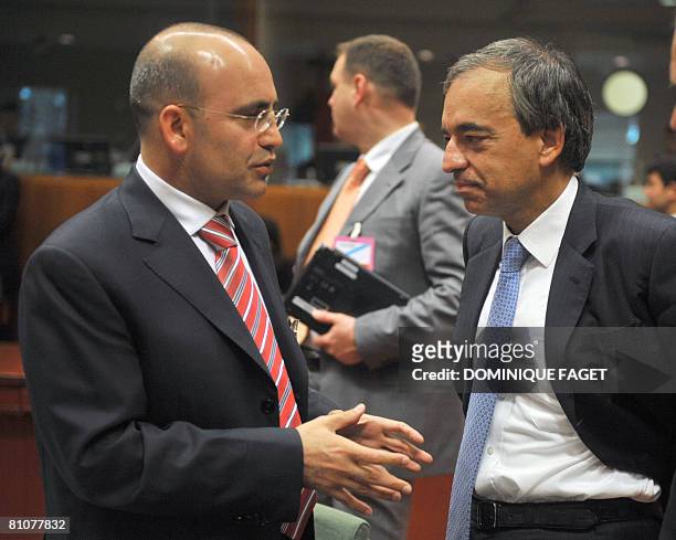 Turkish Economy Minister Mehmet Simsek speaks with Cyprus counterpart Charilaos Stavrakis prior to an Ecofin and candidate countries meeting on May...