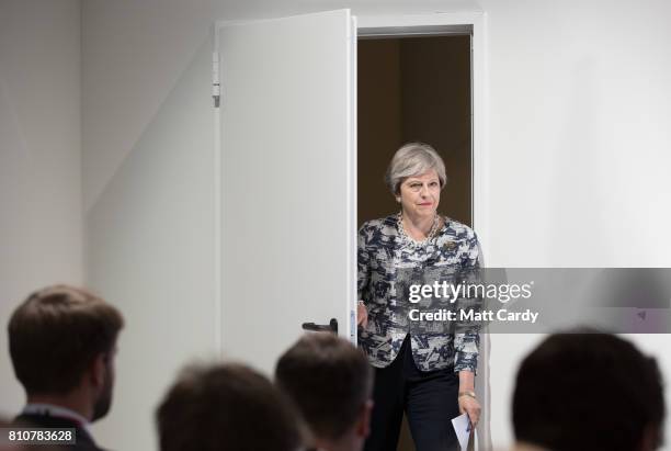 British Prime Minister Theresa May arrives to give a press conference at the end of the second day of the G20 summit on July 8, 2017 in Hamburg,...