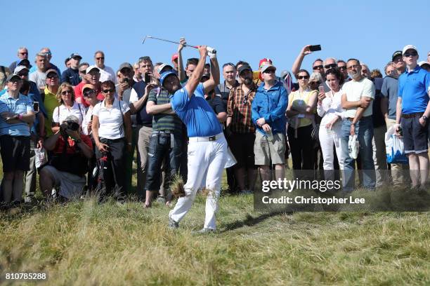 Jon Rahm of Spain hits from the rough on the 17th hole during day three of the Dubai Duty Free Irish Open at Portstewart Golf Club on July 8, 2017 in...