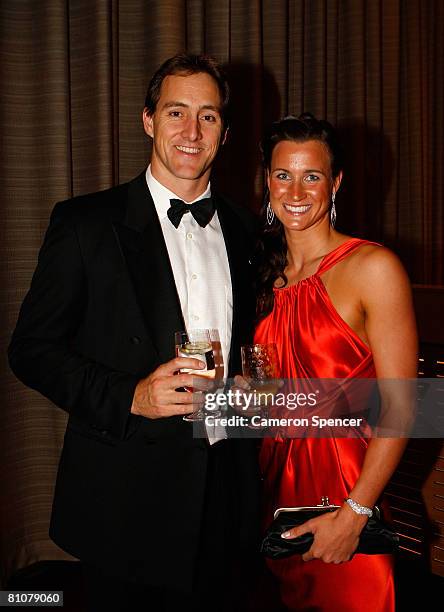 Former Australian Olympic Swimmer Chris Fydler and Australian Olympic swimmer Sophie Edington pose during the Bound for Beijing appeal dinner for the...