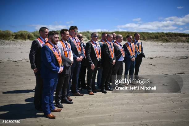 Orangmen take a walk onto the beach as they take part in the annual pre Twelfth of July parade held in Rossnowlagh on July 8, 2017 in Donegal,...