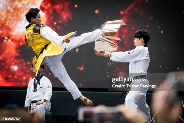 Members of the Kukkiwon Taekwondo Team perform a Taekwondo demonstration during the London Korean Festival 2017 at Olympia London on July 8, 2017 in...