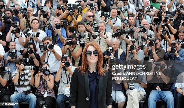Actress Julianne Moore poses with her sunglasses during a photocall for Brazilian director Fernando Meirelles' film 'Blindness' at the 61st edition...