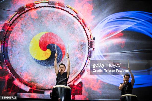 Members from Korean drumming group Tago perform live on stage during the London Korean Festival 2017 at Olympia London on July 8, 2017 in London,...