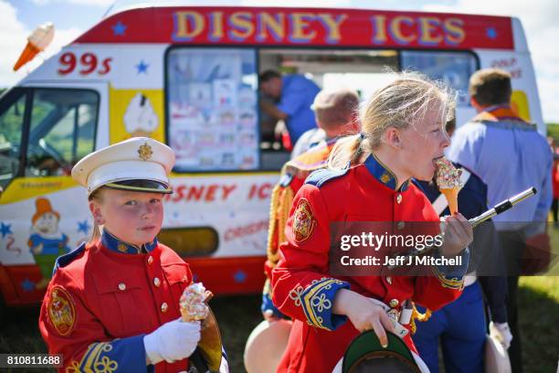 An Band girls eat ice cream following taking part in the annual pre Twelfth of July Orange parade held in Rossnowlagh on July 8, 2017 in Donegal,...