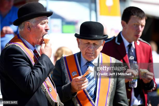 An Orangmen eat ice cream following taking part in the annual pre Twelfth of July parade held in Rossnowlagh on July 8, 2017 in Donegal, Ireland. The...