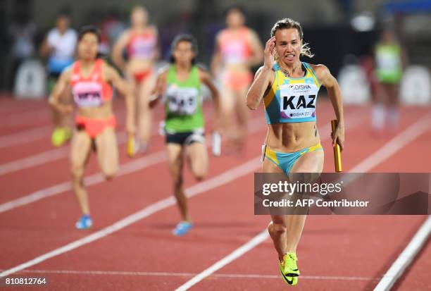 Kazakhstan's Olga Safronova takes the last relay to win the women's 4 X 100m relay, during the third day of the 22nd Asian Athletics Championships at...