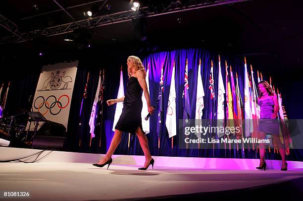 Australian Olympic athletes Amber Halliday and Marguerite Houston arrive on stage during the Bound for Beijing appeal dinner for the 2008 Australian...