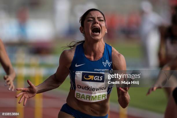 Pamela Dutkiewicz celebrates after winning women's 110 Meter Hurdle Final at day 1 of the German Championships in Athletics at Steigerwaldstadion on...