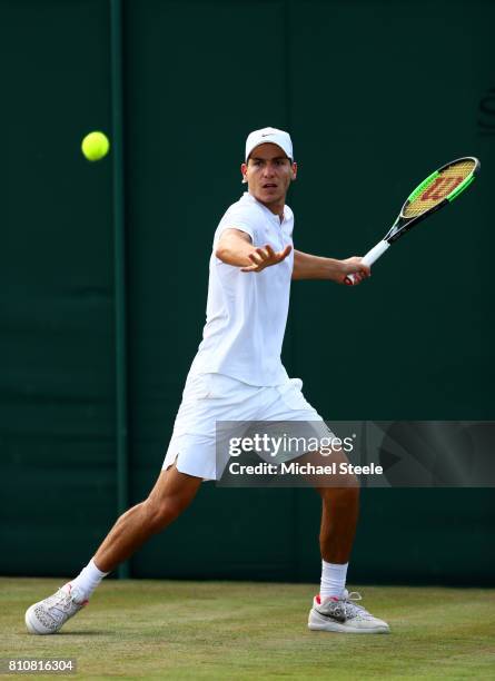 Yshai Oliel of Israel plays a forehand during the Boy's Singles first round match against Alexandre Rotsaert of the United States on day six of the...