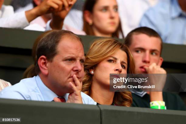 Roger Federer's wife Mirka and agent Tony Godsick look on during the Gentlemen's Singles third round match between Roger Federer of Switzerland and...