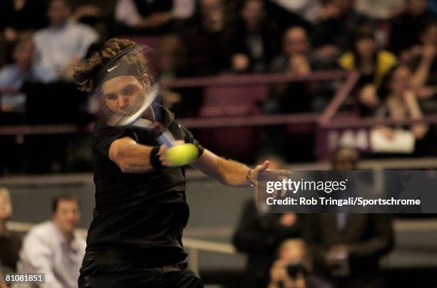 Roger Federer of Switzerland returns to Pete Sampras of the USA during their exhibition match on March 10, 2008 at Madison Square Garden in New York...