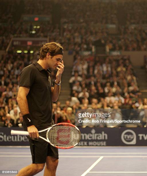 Roger Federer of Switzerland looks on during a match against Pete Sampras of the USA during their exhibition match on March 10, 2008 at Madison...