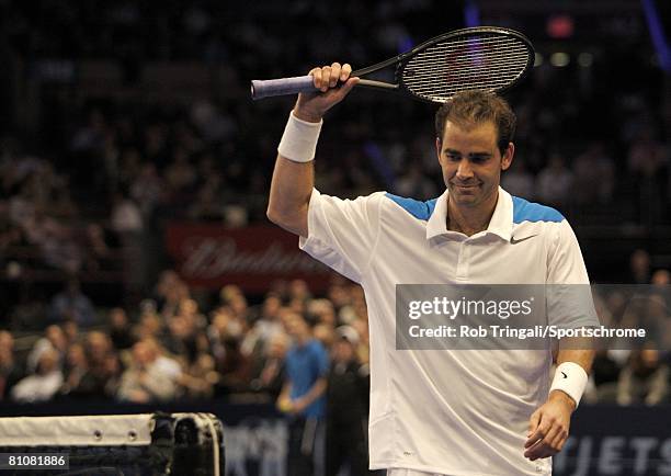 Pete Sampras of the USA looks on against Roger Federer of Switzerland during their exhibition match on March 10, 2008 at Madison Square Garden in New...