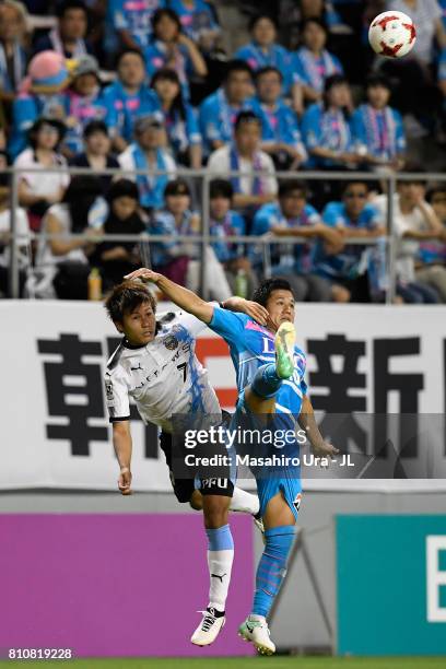 Yuji Ono of Sagan Tosu and Shintaro Kurumaya of Kawasaki Frontale compete for the ball during the J.League J1 match between Sagan Tosu and Kawasaki...