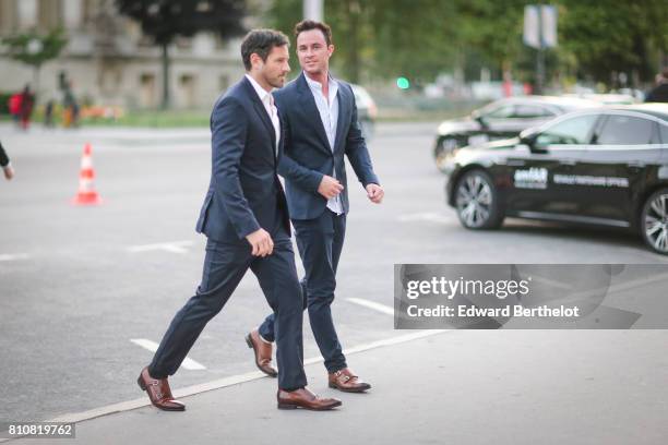 Guests are wearing a suit and a white shirt, and brown leather shoes, outside the amfAR dinner at Petit Palais, during Paris Fashion Week - Haute...