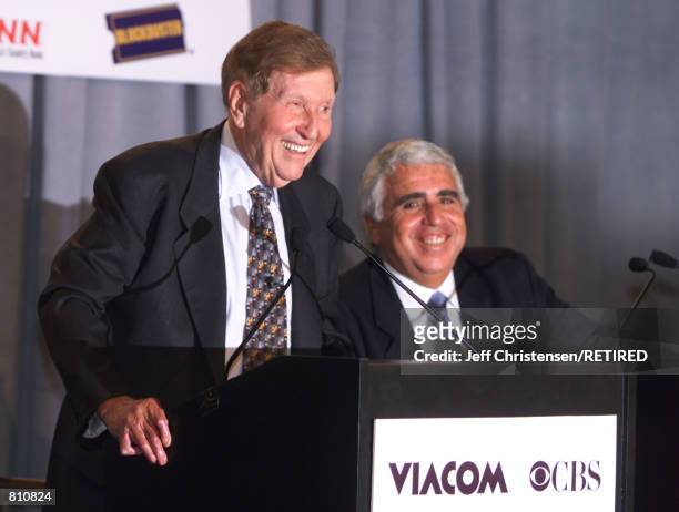 Viacom CEO Sumner Redstone, left, talks to reporters and CBS CEO Mel Karmazin listens as they announced an agreement to merge the two companies...