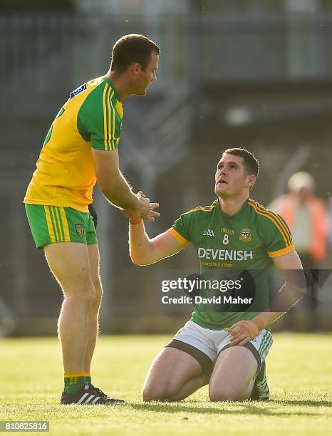 Meath , Ireland - 8 July 2017; A dejected Bryan Menton of Meath as Neil McGee of Donegal helps him to his feet at the end of the GAA Football...