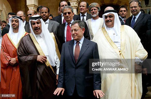 Lebanese Prime Minister Fuad Siniora gestures as he poses for a group picture along with his Qatari counterpart Sheikh Hamad bin Jassem al-Thani ,...