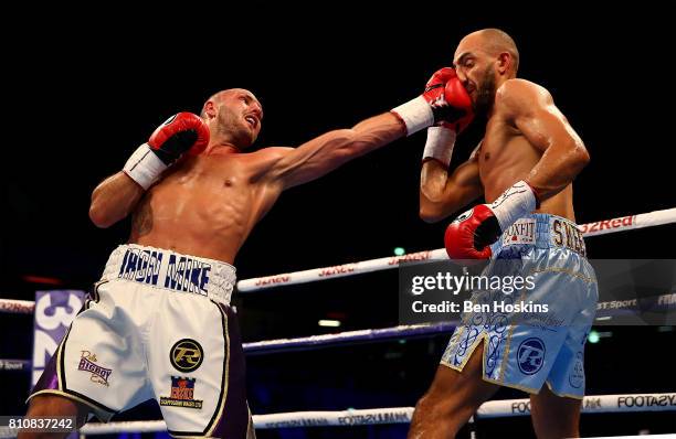 Bradley Skeete of Great Britain and Dale Evans of Great Britain exchange blows during their British Welterweight Championship bout at Copper Box...