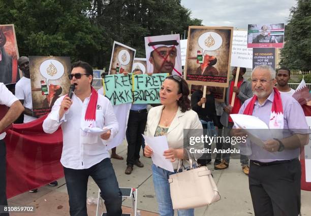 Protester speaks during a demonstration against some Arab countries' diplomatic blockade on Qatar at Broken Chair Monument outisde of the United...