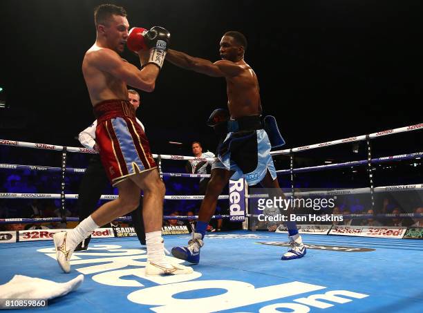 Asina Byfield of Great Britain and Sam McNess of Great Britain exchange blows during their Southern Area Super-Welterweight Championship bout at...