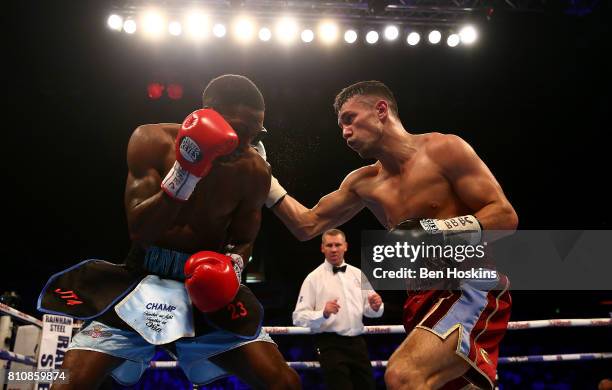 Asina Byfield of Great Britain and Sam McNess of Great Britain exchange blows during their Southern Area Super-Welterweight Championship bout at...