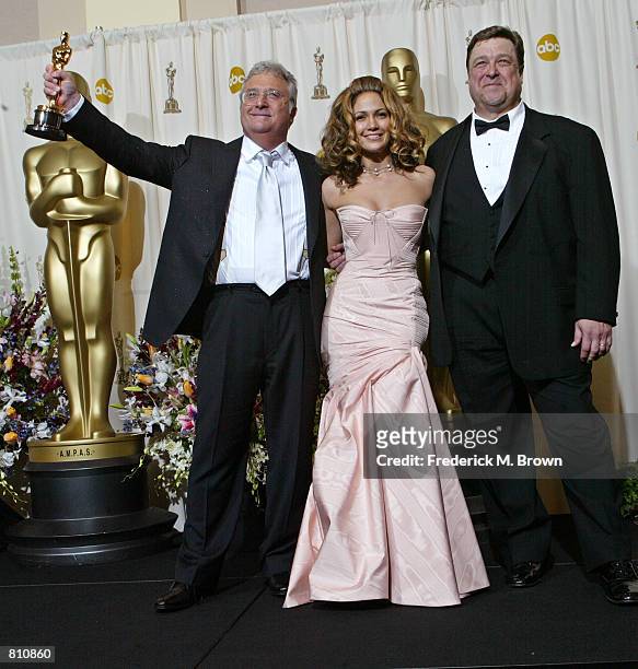 Composer Randy Newman and actors Jennifer Lopez and John Goodman pose backstage with Newman's Best Music Award for his song "If I Didn''t Have You"...