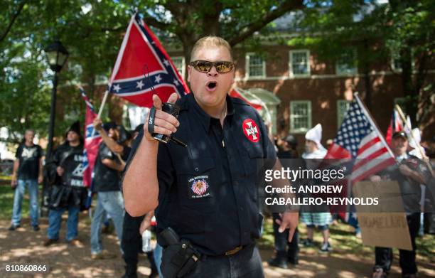 Member of the Ku Klux Klan shouts at counter protesters during a rally, calling for the protection of Southern Confederate monuments, in...