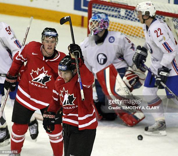 Canada's Derek Roy raises his stick after his 3rd goal against Norway during the quarterfinals of the 2008 IIHF World Hockey Championships at the...