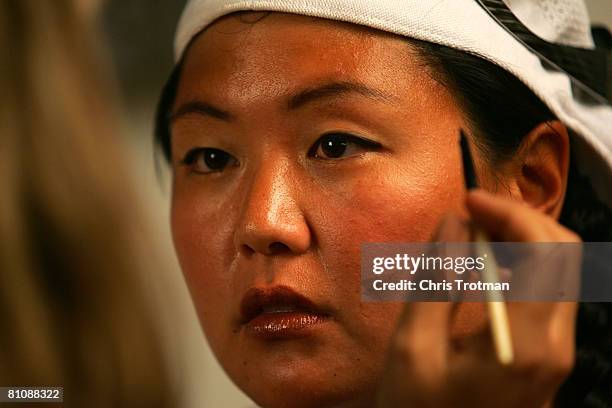 Golfer Christina Kim has her make up applied by makeup artist Bobbi Brown at her the Bobbi Brown studio on May 14, 2008 in Montclair, New Jersey.