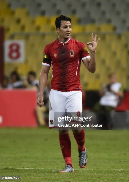 Egypt's Al Ahly footballer Amr Gamal celebrates his goal against Cameroon's Cotonsport during their African Champions League group stage football...