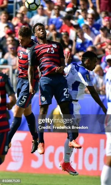 Kellyn Acosta and Matt Besler of USA and Edgar Yoel Barcenas of Panama jump for a ball during the first half of a CONCACAF Gold Cup Soccer match at...