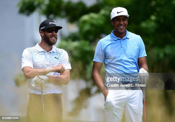 Graham DeLaet of Canada talks with Tony Finau on the sixth tee during round three of The Greenbrier Classic held at the Old White TPC on July 8, 2017...