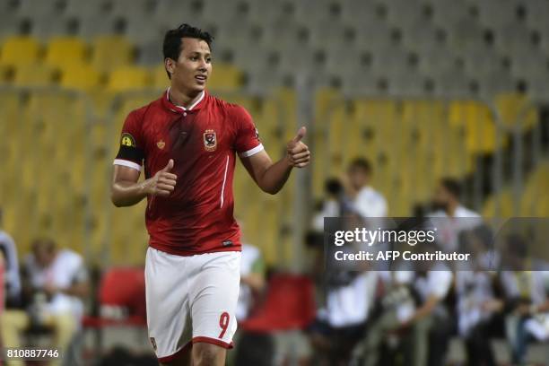 Egypt's Al Ahly footballer Amr Gamal celebrates his goal against Cameroon's Cotonsport during their African Champions League group stage football...