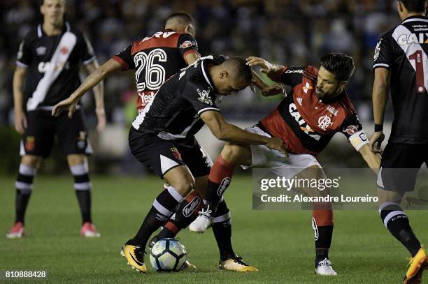 Luis Fabiano of Vasco da Gama battles for the ball with Gustavo CuÃ©llar and Diego of Flamengo during the match between Vasco da Gama and Flamengo as...