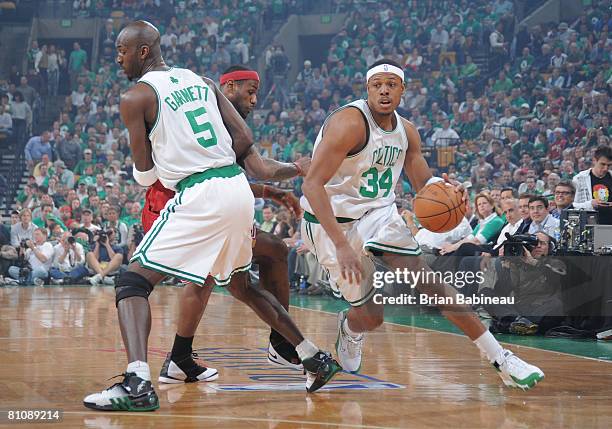 Paul Pierce of the Boston Celtics drives around Lebron James of the Cleveland Cavaliers with the help of Kevin Garnett of the Boston Celtics in Game...