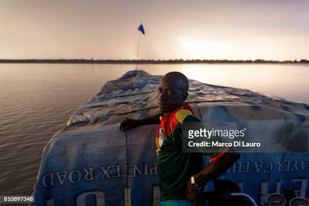 NA Malian man is seen on a boat in navigation on the Niger River on August 8, 2013 on the Niger River from Mopti to Timbuktu, Mali"nIn January 2012 a...