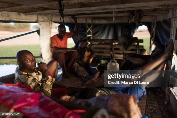 NMalian are seen on a boat in navigation on the Niger River on August 8, 2013 on the Niger River from Mopti to Timbuktu, Mali"nIn January 2012 a...