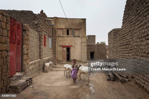 NA Malian girl is seen in front of her house on August 10, 2013 in Timbuktu, Mali"nIn January 2012 a Tuareg rebellion began in Northern Mali, led by...