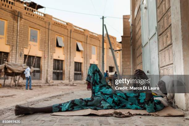 NA Malian man is seen resting in the street at the market on August 11, 2013 in Timbuktu, Mali"nIn January 2012 a Tuareg rebellion began in Northern...