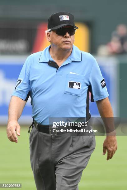 Umpire Larry Vanover looks on during a baseball game between the Baltimore Orioles and the Tampa Bay Rays at Oriole Park at Camden Yards on July 2,...