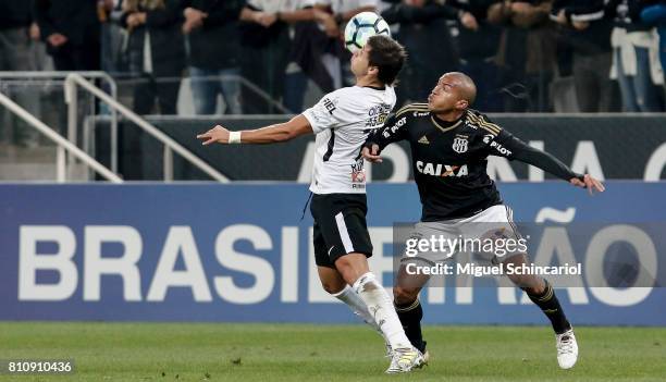 Angel Romero of Corinthians vies for the ball with Nino Paraba of Ponte Preta during the match between Corinthians and Ponte Preta for the...