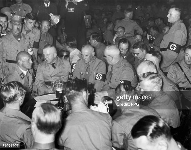 Prominent Nazi Party members at a party at the Burgerbraukeller, Munich, to mark the 14th anniversary of the 1923 Beer Hall Putsch, 9th November...