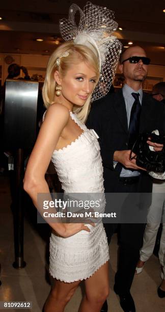 Paris Hilton poses during a photocall to launch her new fragrance 'Can Can' at Selfridges on May 15, 2008 in London, England.