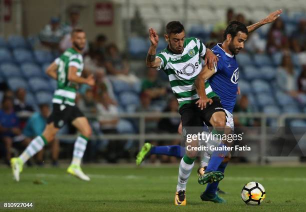 Belenenses's forward Tiago Caeiro from Portugal with Sporting CPÕs midfielder Bruno Fernandes from Portugal in action during the Pre-Season Friendly...