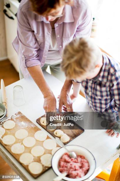 seniors at home - grandson stock pictures, royalty-free photos & images