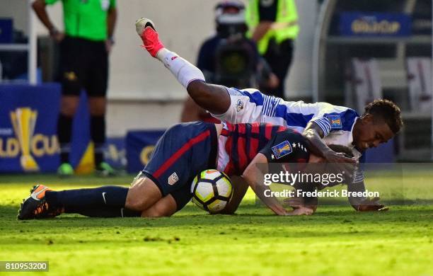 Edgar Yoel Barcenas of Panama falls on Matt Besler of USA during the second half of a CONCACAF Gold Cup Soccer match at Nissan Stadium on July 8,...