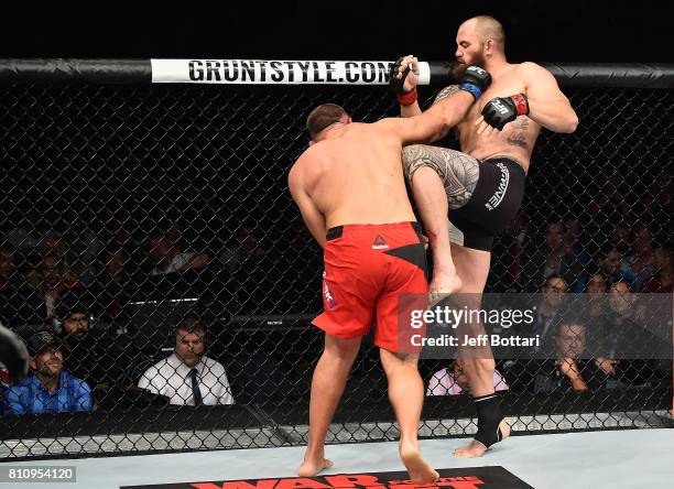 Aleksei Oleinik of Russia punches Travis Browne in their heavyweight bout during the UFC 213 event at T-Mobile Arena on July 8, 2017 in Las Vegas,...